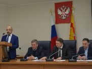 На общественных слушаниях.