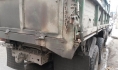 Парни сливали топливо из грузовиков.