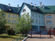 В поселке.