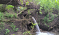 Одна из двух труб водосброса накренилась.